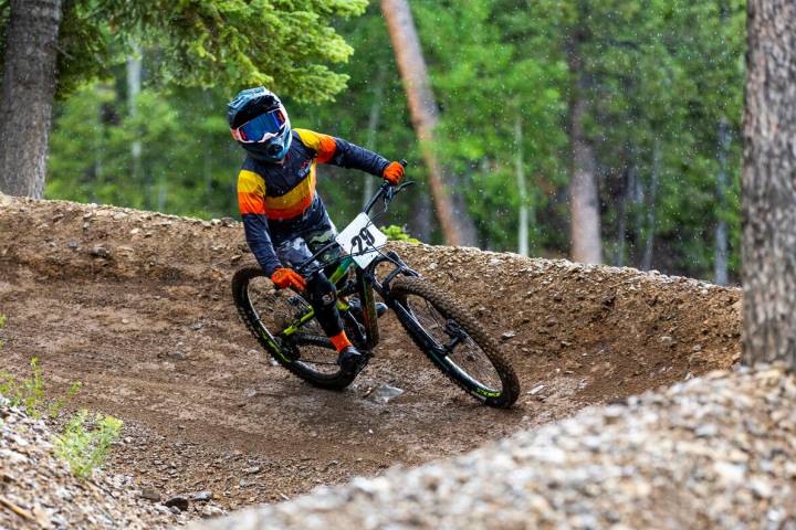 Youth boy rider Mason Conarro turns a corner as the rain comes down during the Viva La Gravity ...