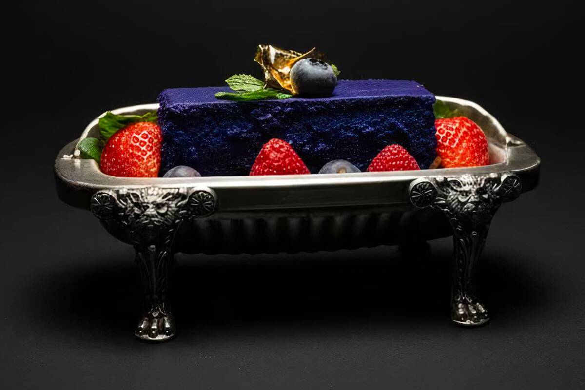 "The Cake of the Fates," an ube-infused cheesecake, fresh seasonal berries, raspberry coulis at ...