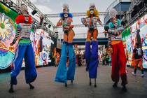 Festival performers dance during the first day of Electric Daisy Carnival at Las Vegas Motor Sp ...