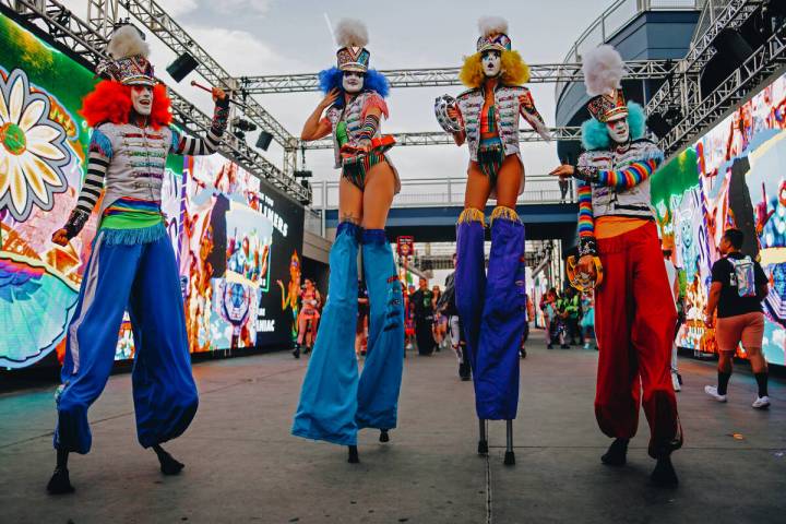 Festival performers dance during the first day of Electric Daisy Carnival at Las Vegas Motor Sp ...