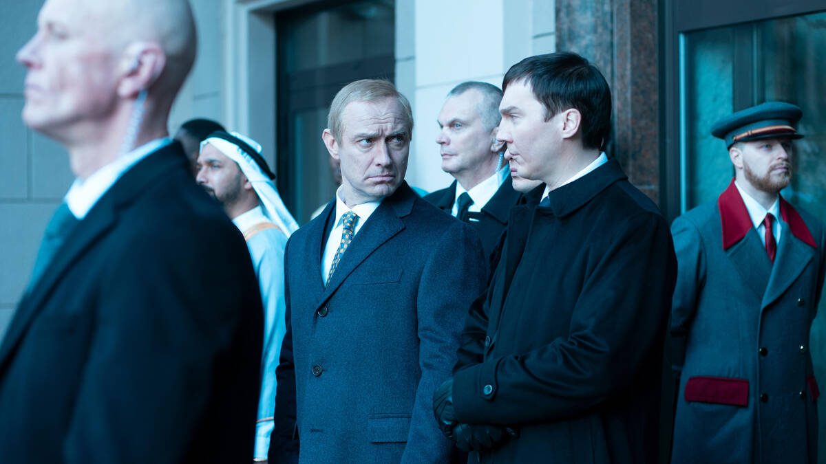 Jude Law and Paul Dano in a scene from "The Wizard of the Kremlin." (Vertical)