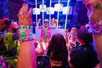 Festival attendees play games for kandi during day one of the Electric Daisy Carnival festival ...