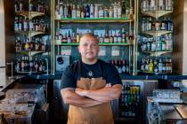 Chef-owner Brad Wise takes a moment in the bar of his Rare Society, a live-fire steakhouse that ...