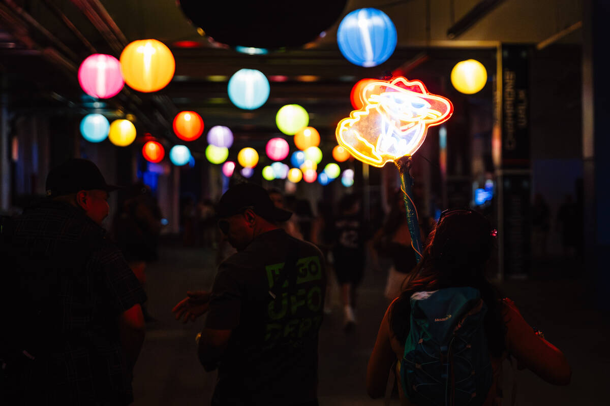 Attendees walk into the speedway during day two of Electric Daisy Carnival Saturday, May 16, 20 ...