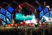 Attendees take in a DJ set during day two of Electric Daisy Carnival at Las Vegas Motor Speedwa ...