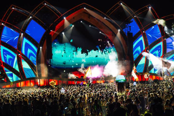 Attendees take in a DJ set during day two of Electric Daisy Carnival at Las Vegas Motor Speedwa ...