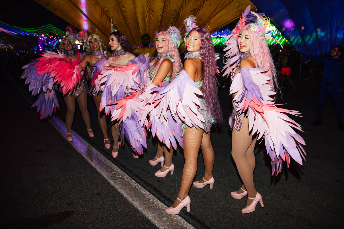Performers pose during day two of Electric Daisy Carnival at Las Vegas Motor Speedway Saturday, ...