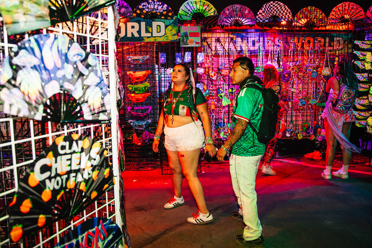 Attendees look at fans for sale during day two of Electric Daisy Carnival at Las Vegas Motor Sp ...