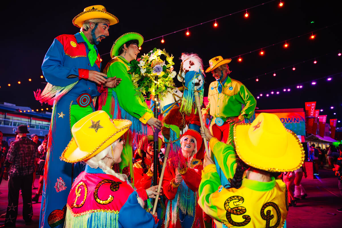 Performers interact with a totem during day two of Electric Daisy Carnival at Las Vegas Motor S ...