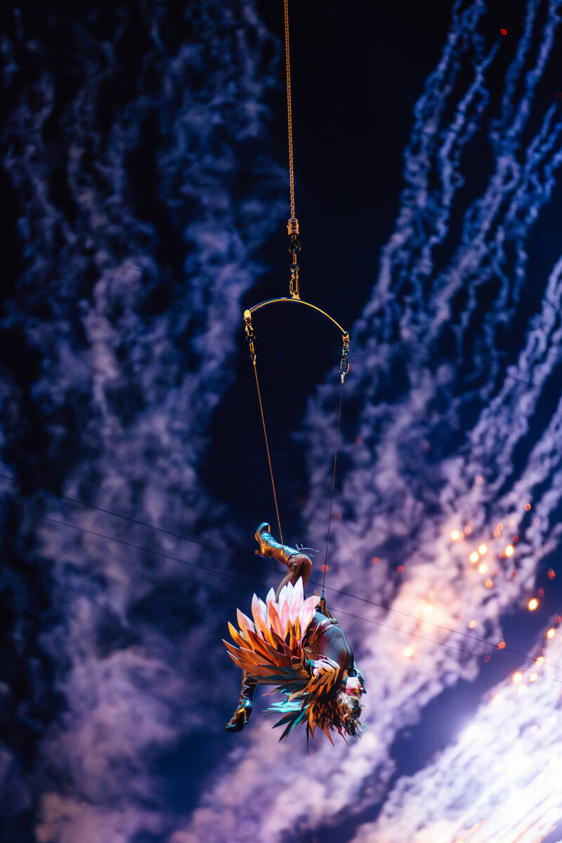 A performer twirls in the air during day two of Electric Daisy Carnival at Las Vegas Motor Spee ...