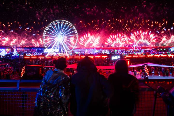 Attendees watch as fireworks go off during the final night of the Electric Daisy Carnival at La ...