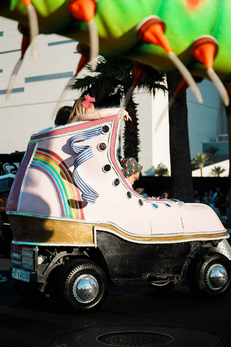 Roller skate parade float drives down Las Vegas Blvd. during debut of an Electric Daisy Carniva ...