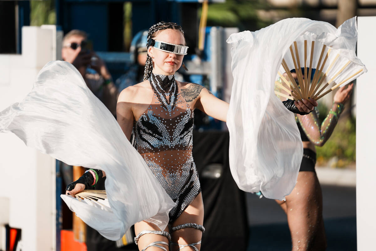 World Party Parade performer waves fans during debut of an Electric Daisy Carnival parade down ...