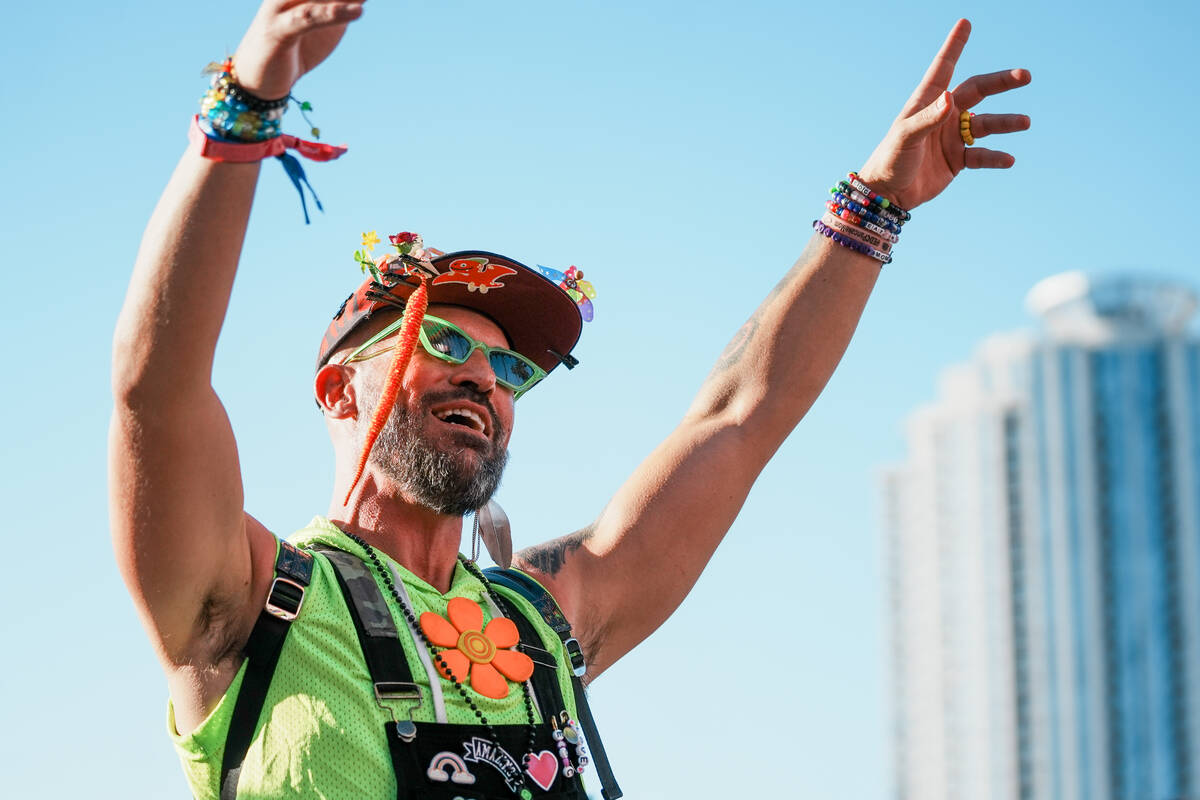World Party Parade goer Tanner Cook dances during the debut of the Electric Daisy Carnival para ...