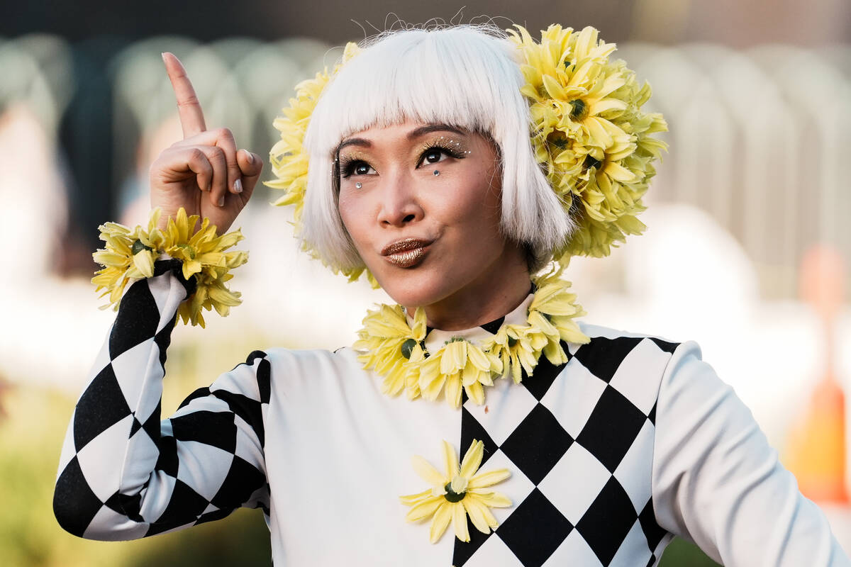 World Party Parade performer dances during the debut of the Electric Daisy Carnival parade down ...