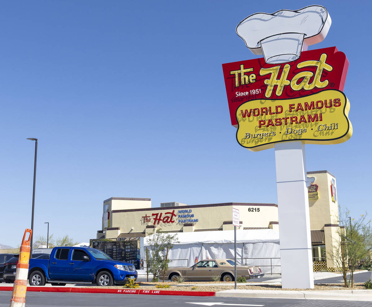 Cars wait at the drive thru lane at The Hat during the restaurant’s grand opening on Wed ...