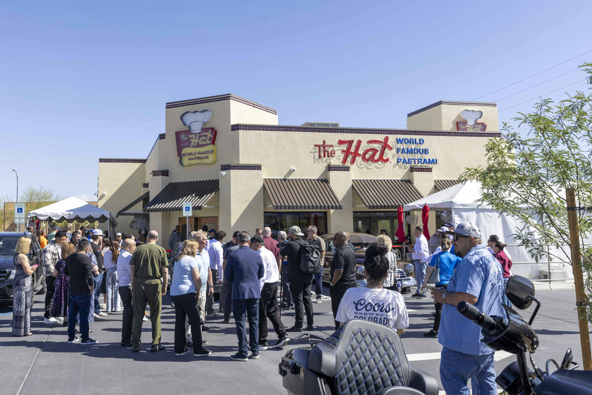 A line of customers waits outside The Hat during the restaurant’s grand opening on on We ...