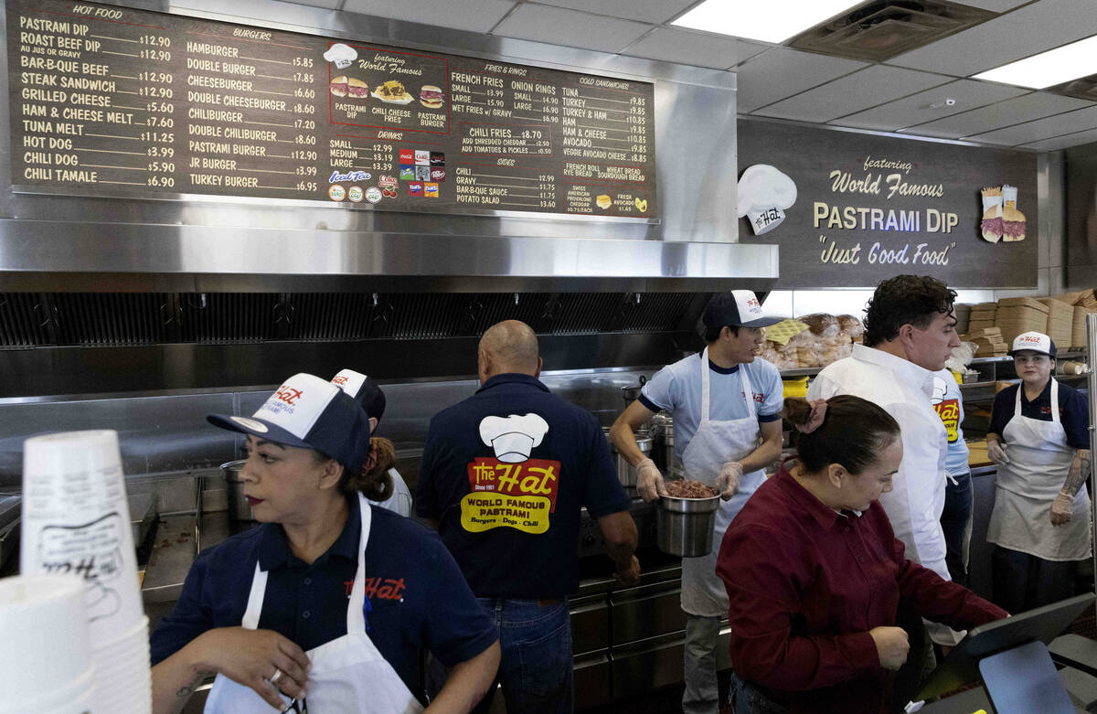 Workers prepare their stations at The Hat during the restaurant’s grand opening on Wedne ...