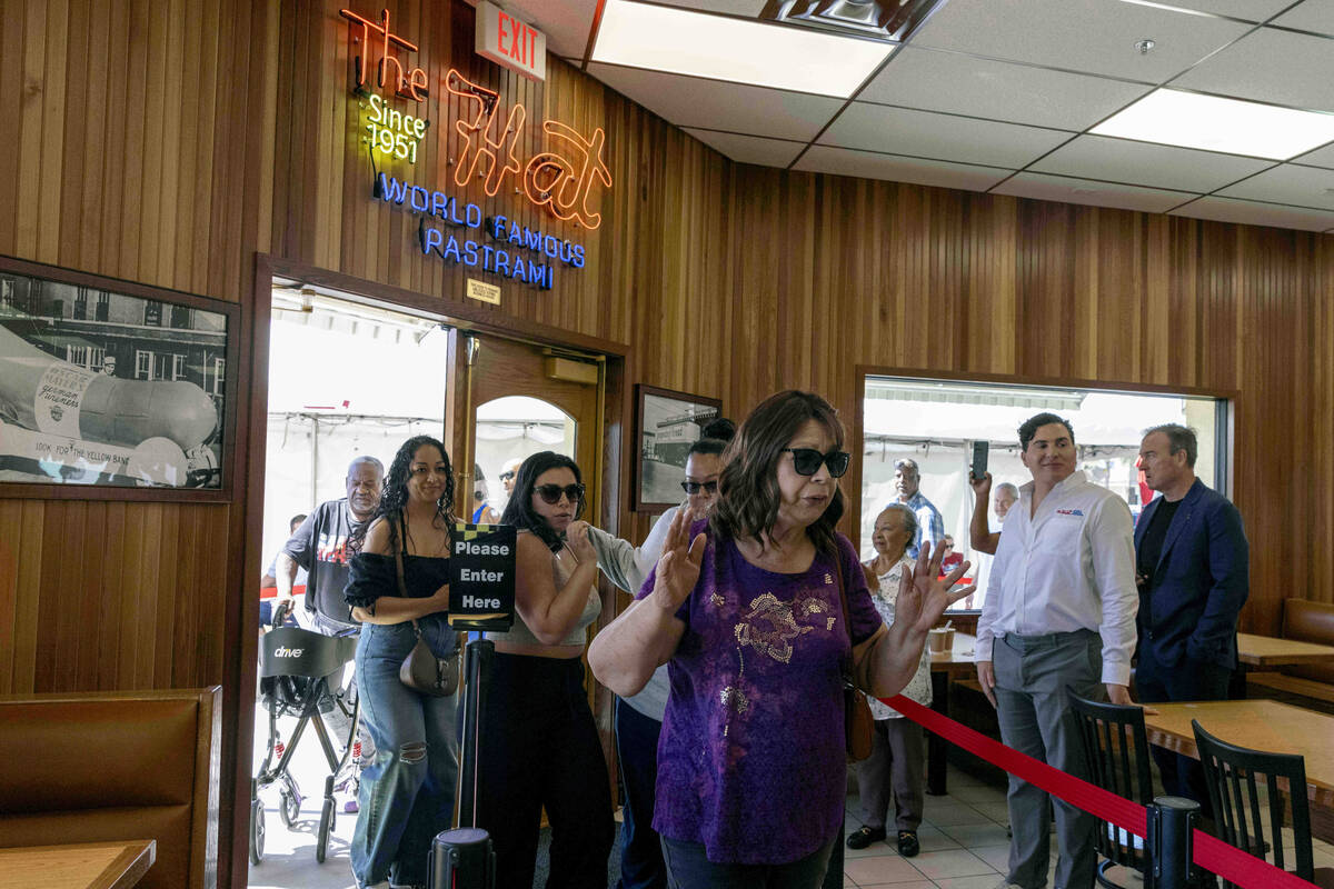 The first customers arrive at The Hat during the restaurant’s grand opening on Wednesday ...