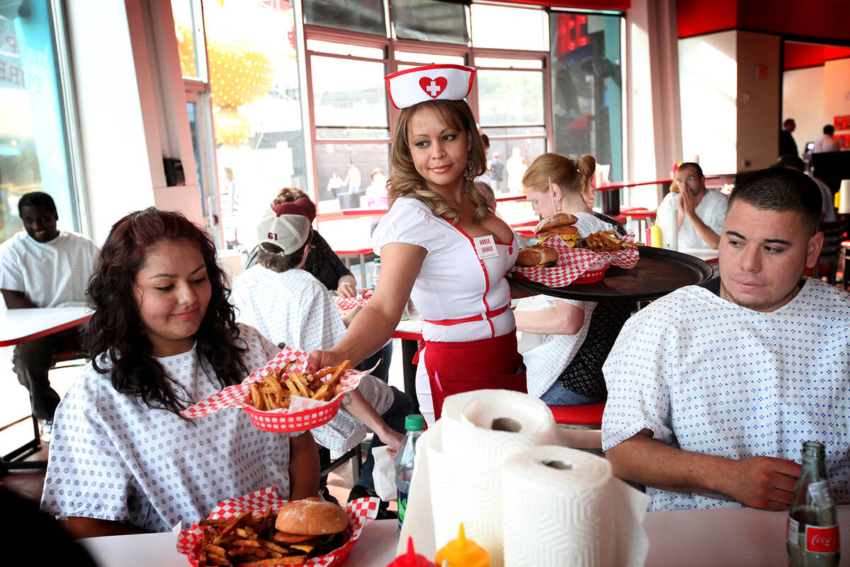 Jaimee Lee serves customers at the Heart Attack Grill in downtown Las Vegas on Monday, Mar. 5, ...