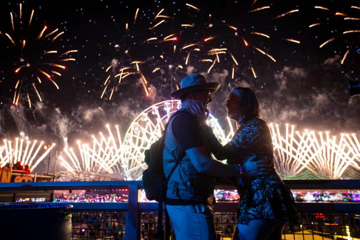 A couple reacts as fireworks go off during the final night of the Electric Daisy Carnival at La ...