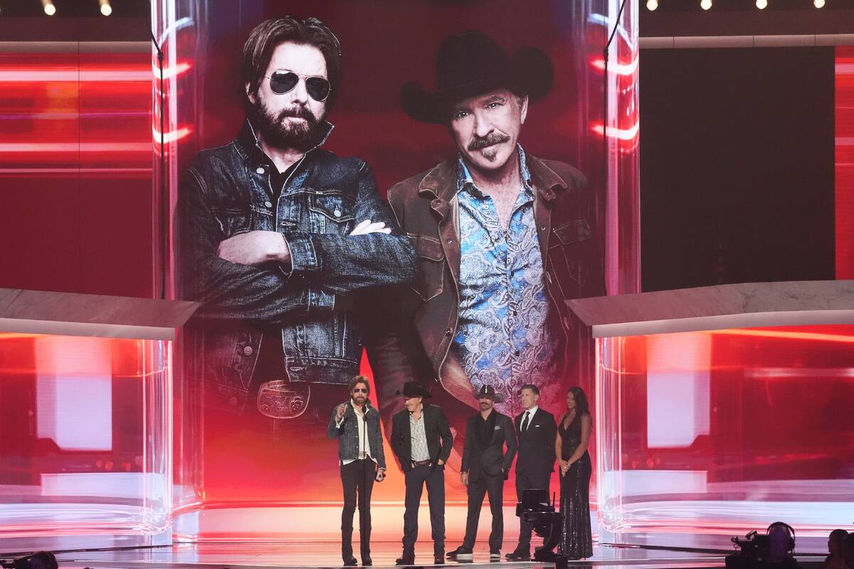 Ronnie Dunn, left, and Kix Brooks of "Brooks & Dunn" accept the award for duo of ...