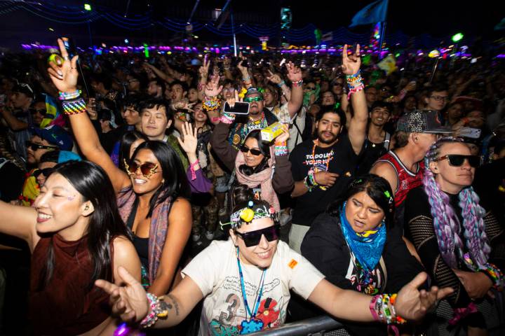 Attendees dance during the final night of the Electric Daisy Carnival at Las Vegas Motor Speedw ...