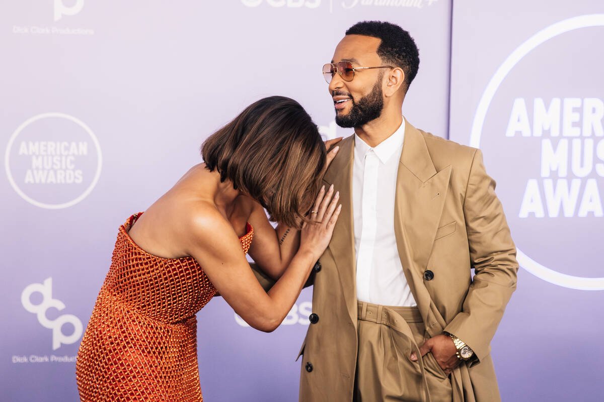 Chrissy Teigen, left, and John Legend on the American Music Awards red carpet at MGM Grand Gard ...