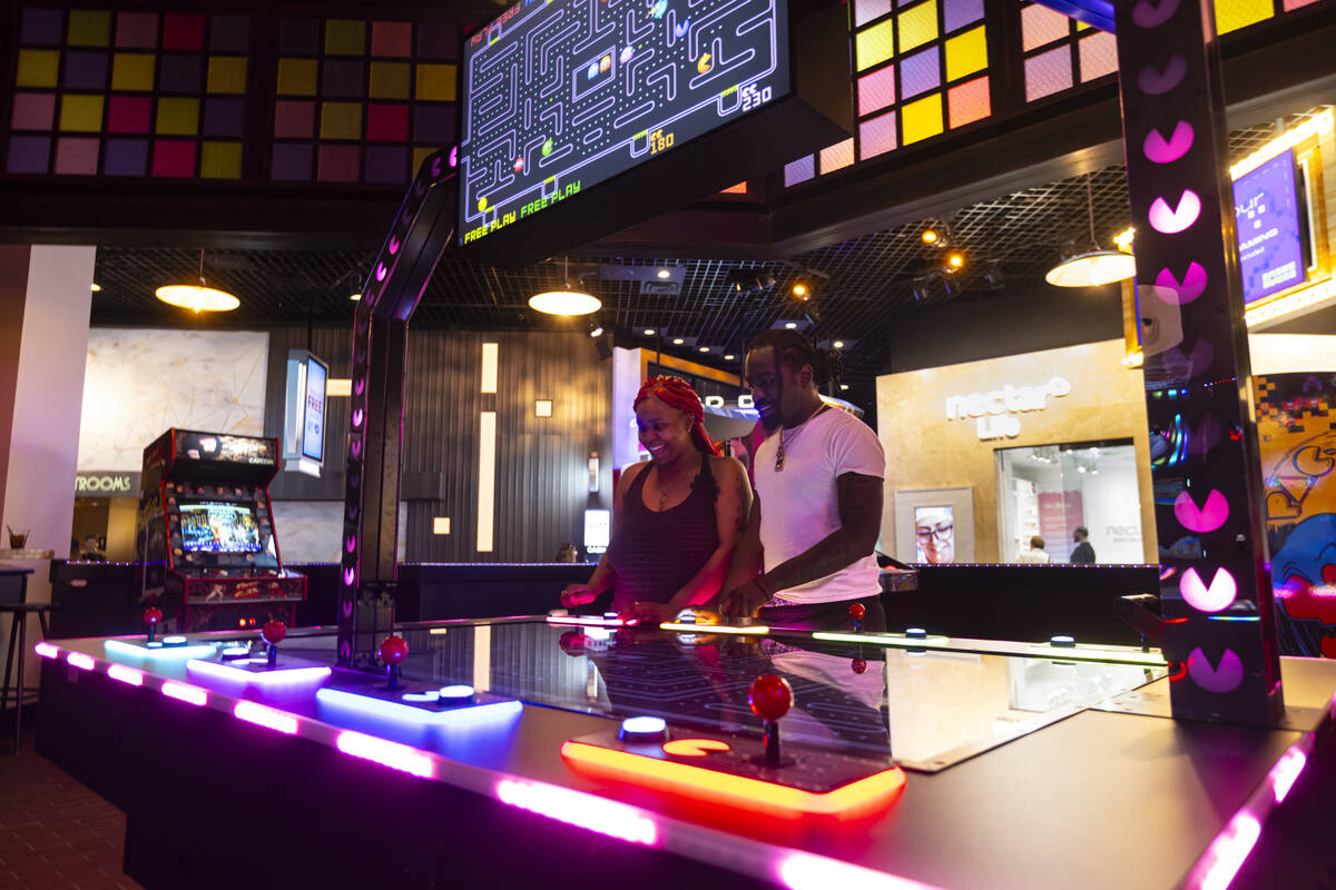 Nelly Livingston, of Arizona, left, and Jay Stevenson, of Washington. D.C, play Pac-Man at the ...