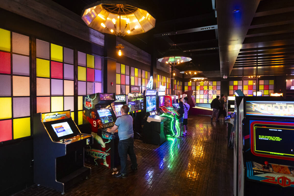 People play games at the Bonus Round arcade bar at The District at MGM Grand on Thursday, May 2 ...