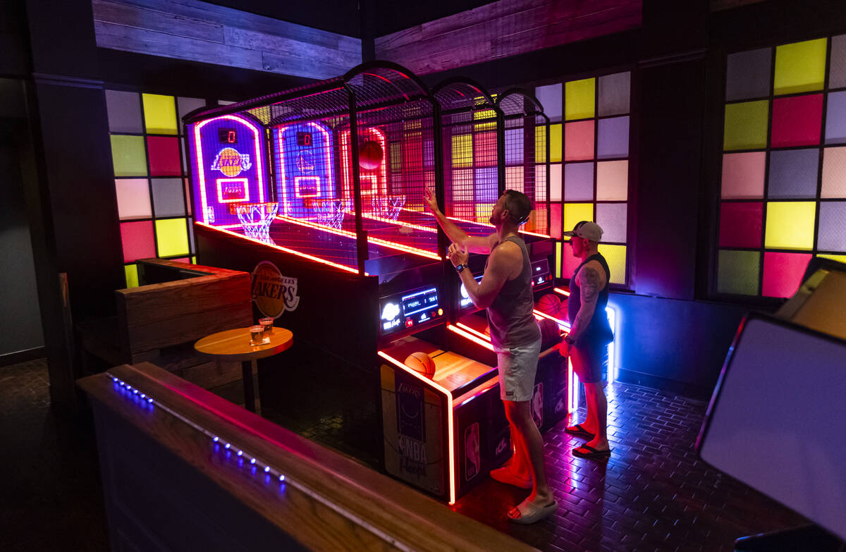 People play arcade games at the Bonus Round arcade bar at The District at MGM Grand on Thursday ...