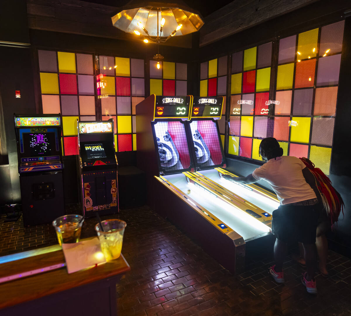Jay Stevenson, of Washington. D.C., and Nelly Livingston, of Arizona, play games at the Bonus R ...