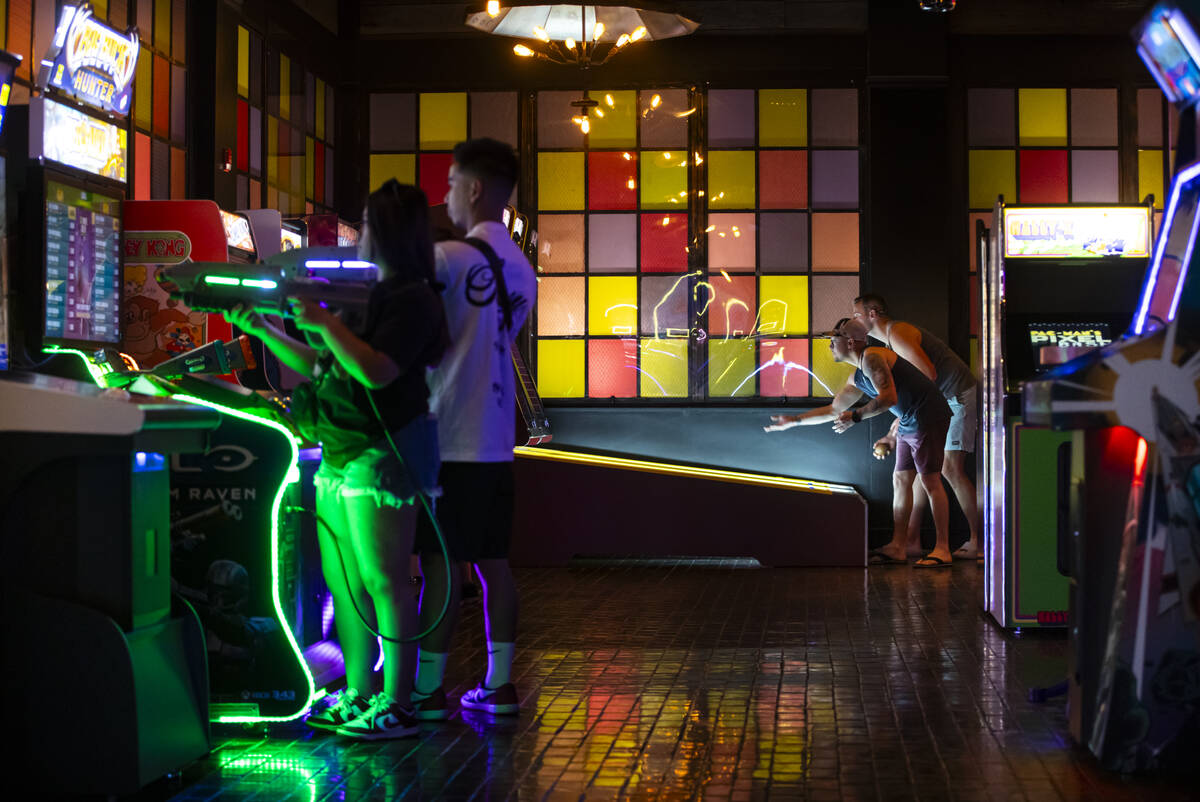 People play arcade games at the Bonus Round arcade bar at The District at MGM Grand on Thursday ...