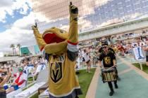 Golden Knights mascot Chance the Gila monster makes an appearance during a watch party for Game ...