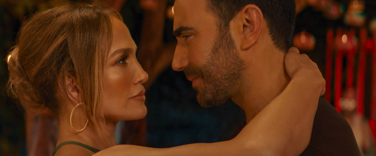 Jennifer Lopez as Jackie Cruz and Brett Goldstein as Daniel Blanchflower in "Office Romance." ( ...