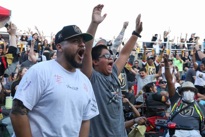 Fans celebrate the Golden Knights scoring during the Stanley Cup championship at the Water Stre ...
