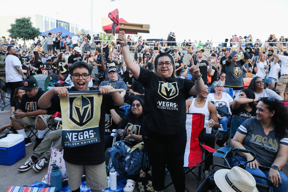 Fans celebrate the Golden Knights scoring during the Stanley Cup championship at the Water Stre ...