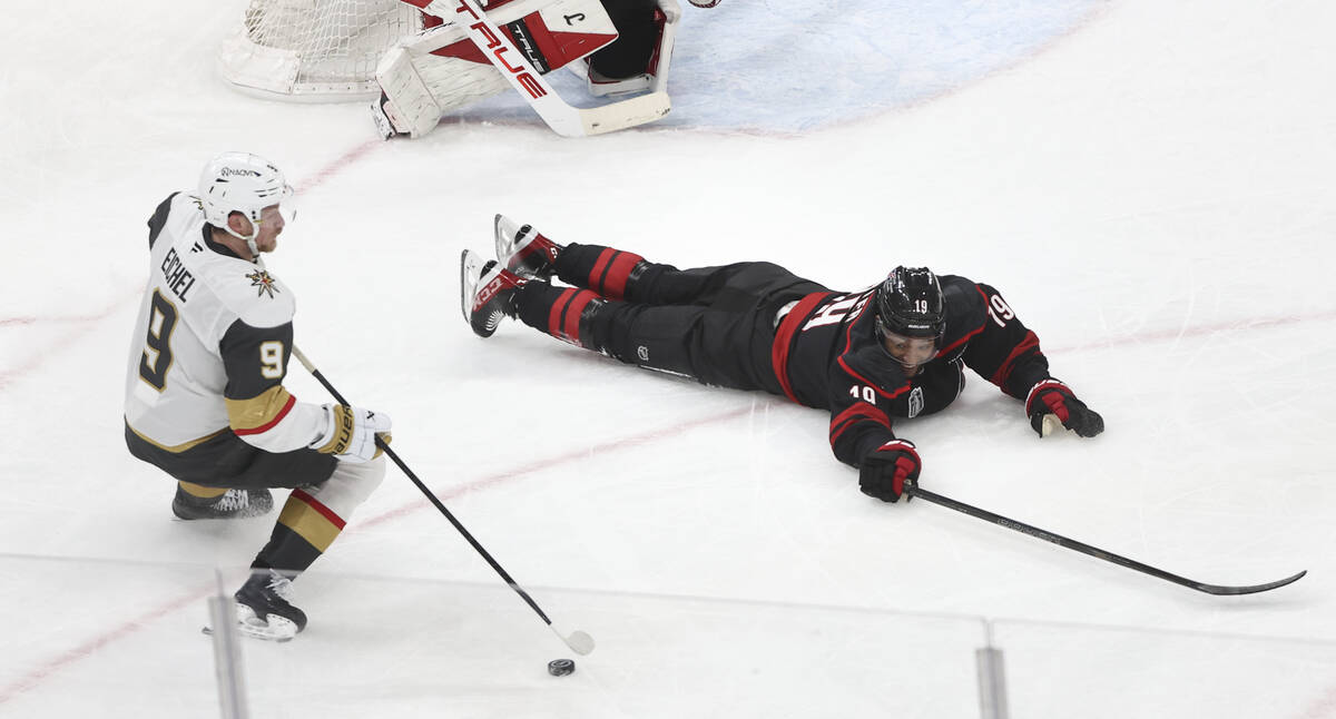 Carolina Hurricanes defenseman K'andre Miller (19) slides on the ice as Golden Knights cen ...