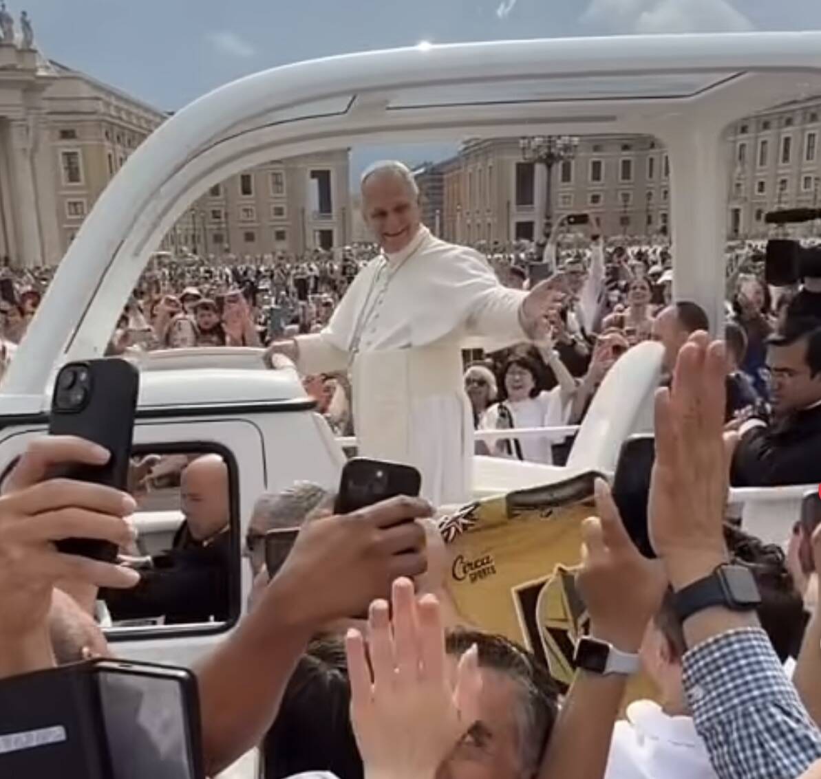 A screenshot of Pope Leo passing Mark Shunock as Shunock holds up a custom-made Golden Knights ...