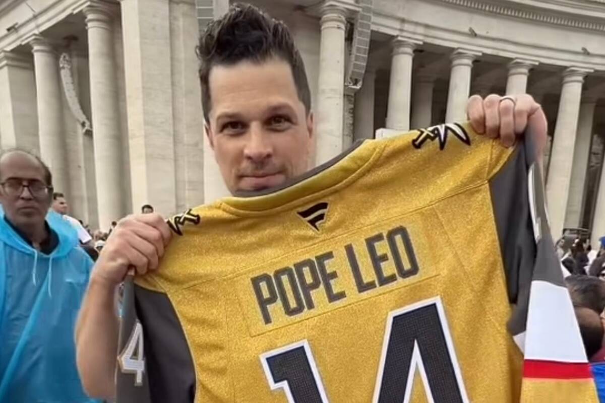 A screenshot of Mark Shunock as he holds up a custom-made Golden Knights No. 14 jersey at mass ...