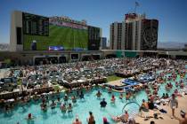 Fans watch a live broadcast of a World Cup soccer match between the U.S. and Australia from a p ...