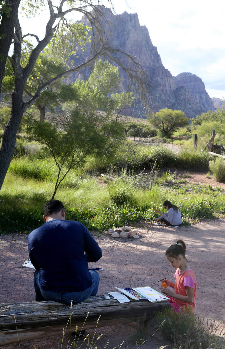 Jeff Larsen and his daughter Evelyn Larsen, 8, of Las Vegas participate in the Paint With a Ran ...