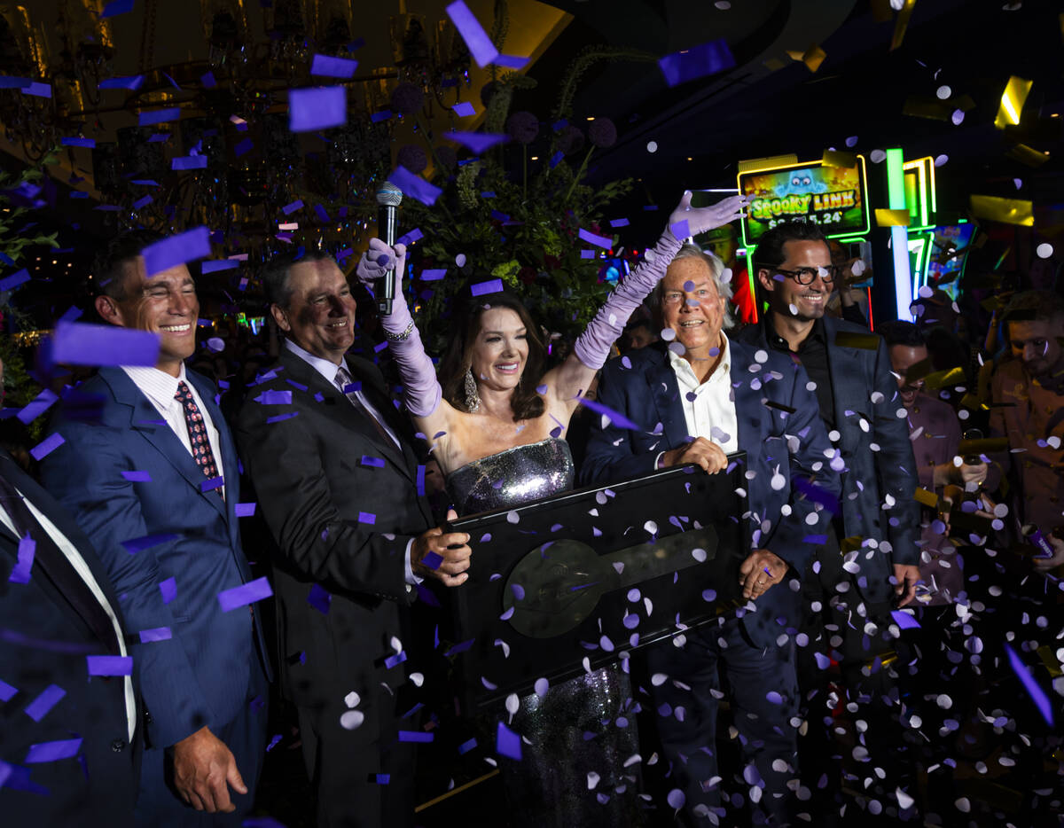 Lisa Vanderpump, center, celebrates as confetti goes off to celebrate the grand opening of The ...