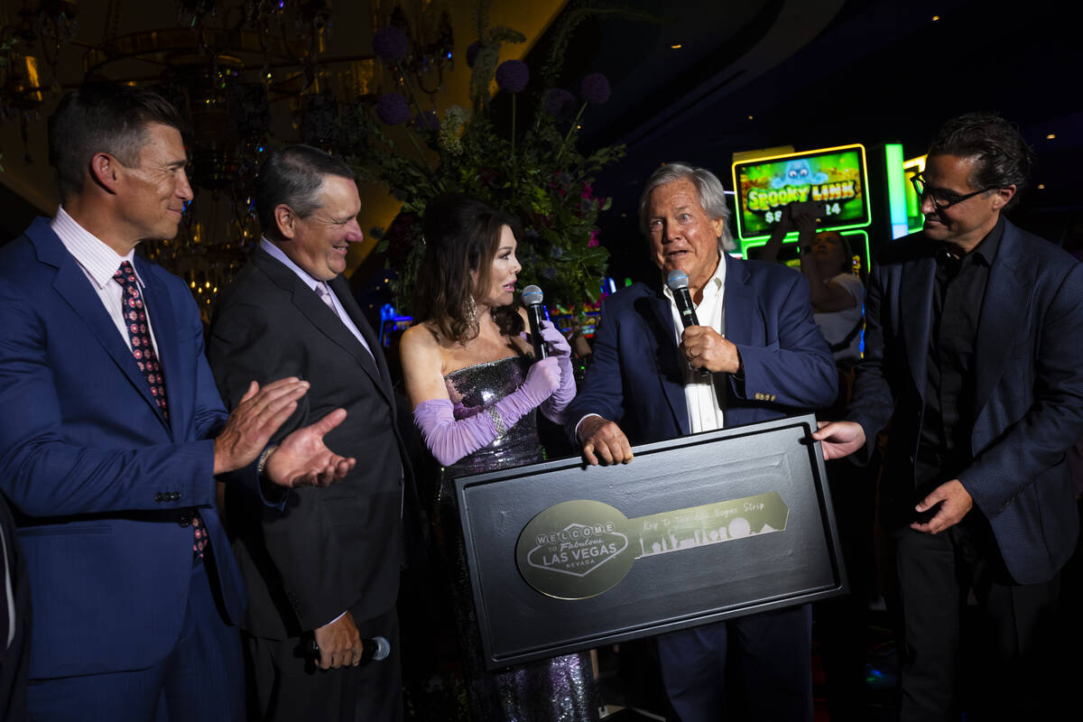 Lisa Vanderpump, center, is presented with the Key to The Strip by Clark County Commissioner Ti ...