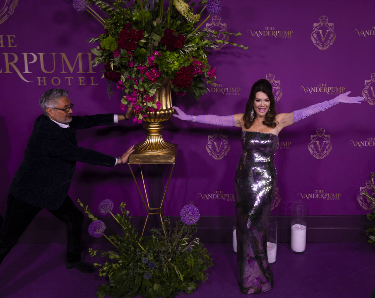 Lisa Vanderpump poses with designer Nick Alain on the red carpet for the grand opening of The V ...