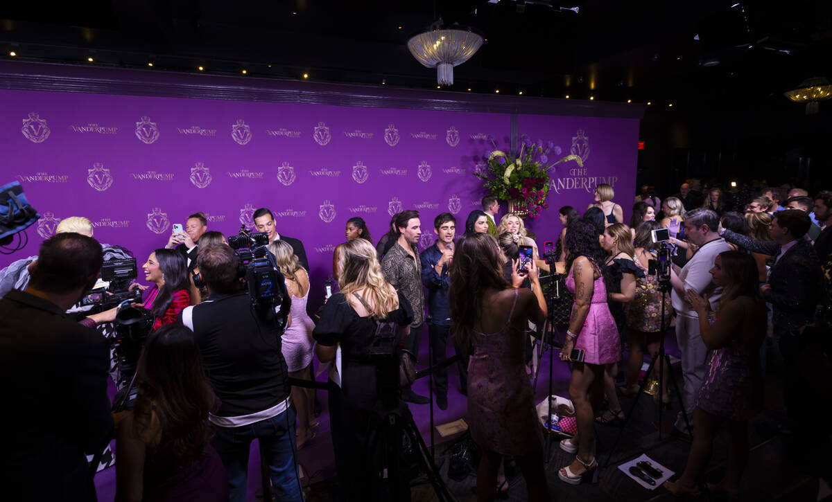 Attendees are interviewed on the red carpet for the grand opening of The Vanderpump Hotel on Th ...