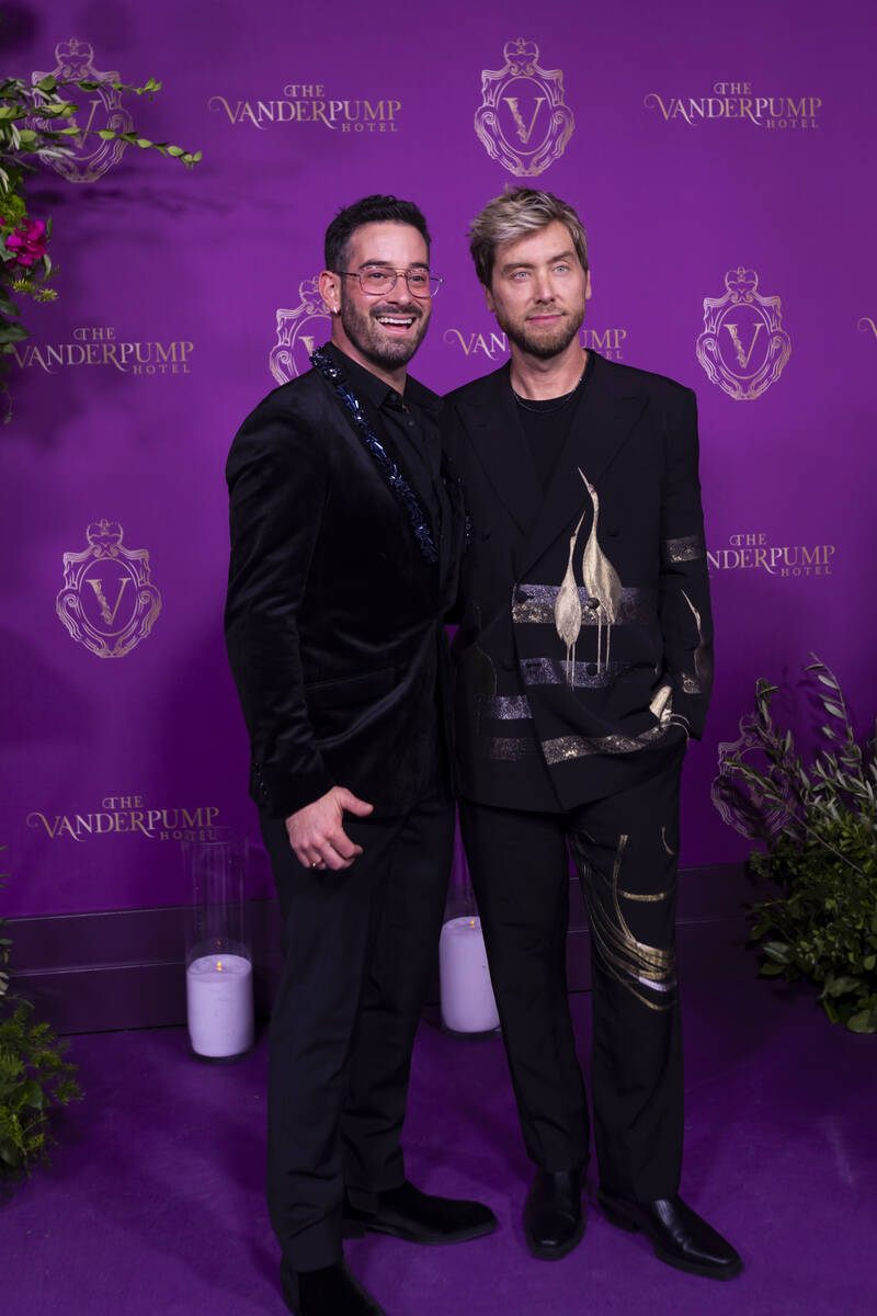 Lance Bass, of NSYNC, right, and husband Michael Turchin pose on the red carpet for the grand o ...