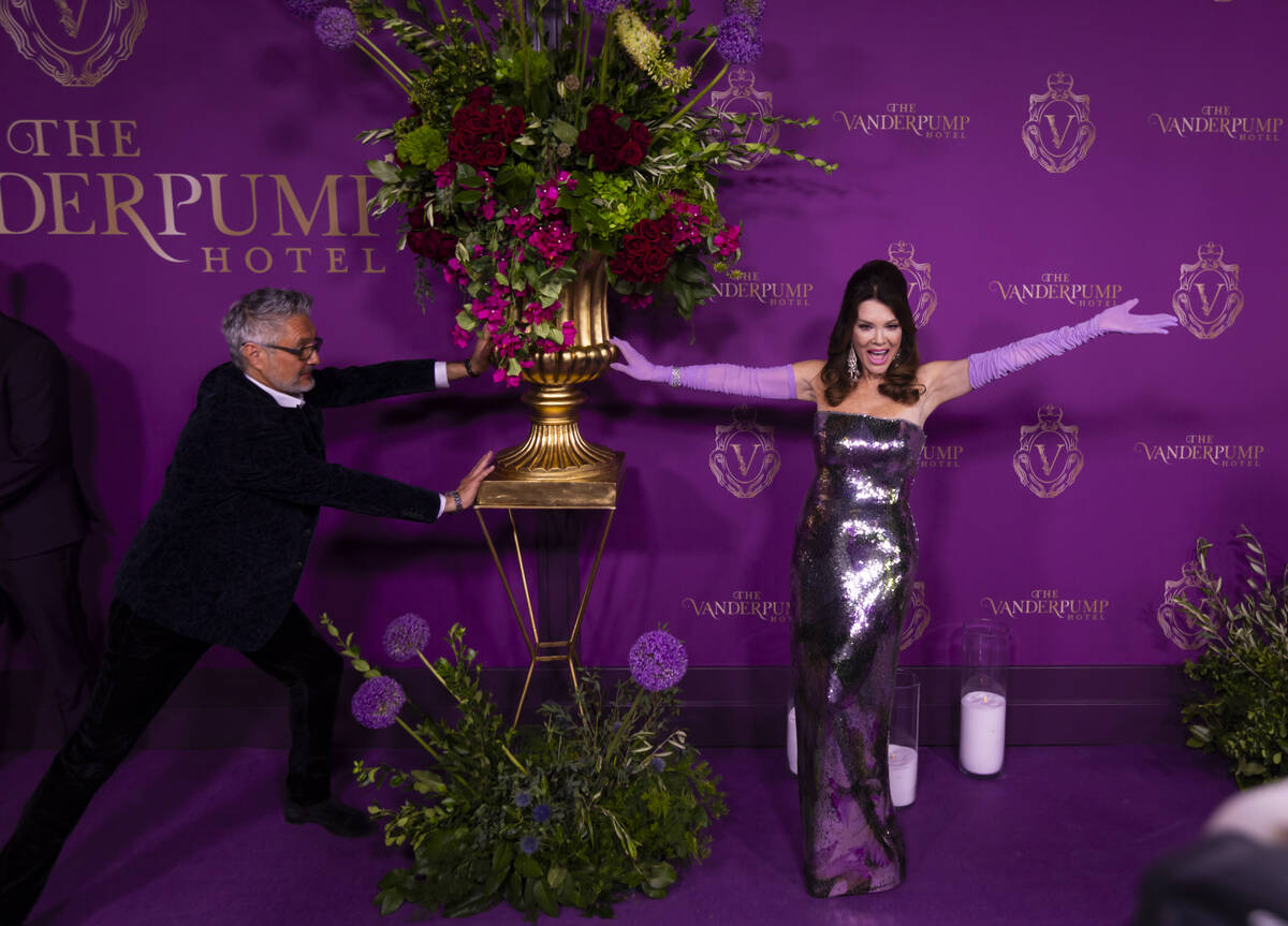 Lisa Vanderpump poses with designer Nick Alain on the red carpet for the grand opening of The V ...
