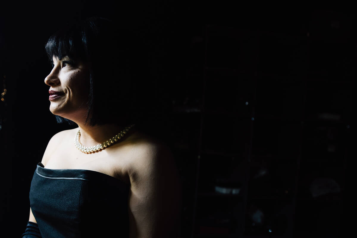 Tia Bean looks into a mirror backstage before a showing of ClueX, a burlesque parody, at Notori ...