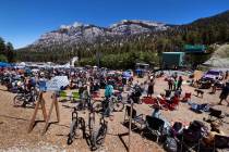 People gather about the Mountain Fest stage on Rabbit Peak to listen to the Smokestacks play, e ...